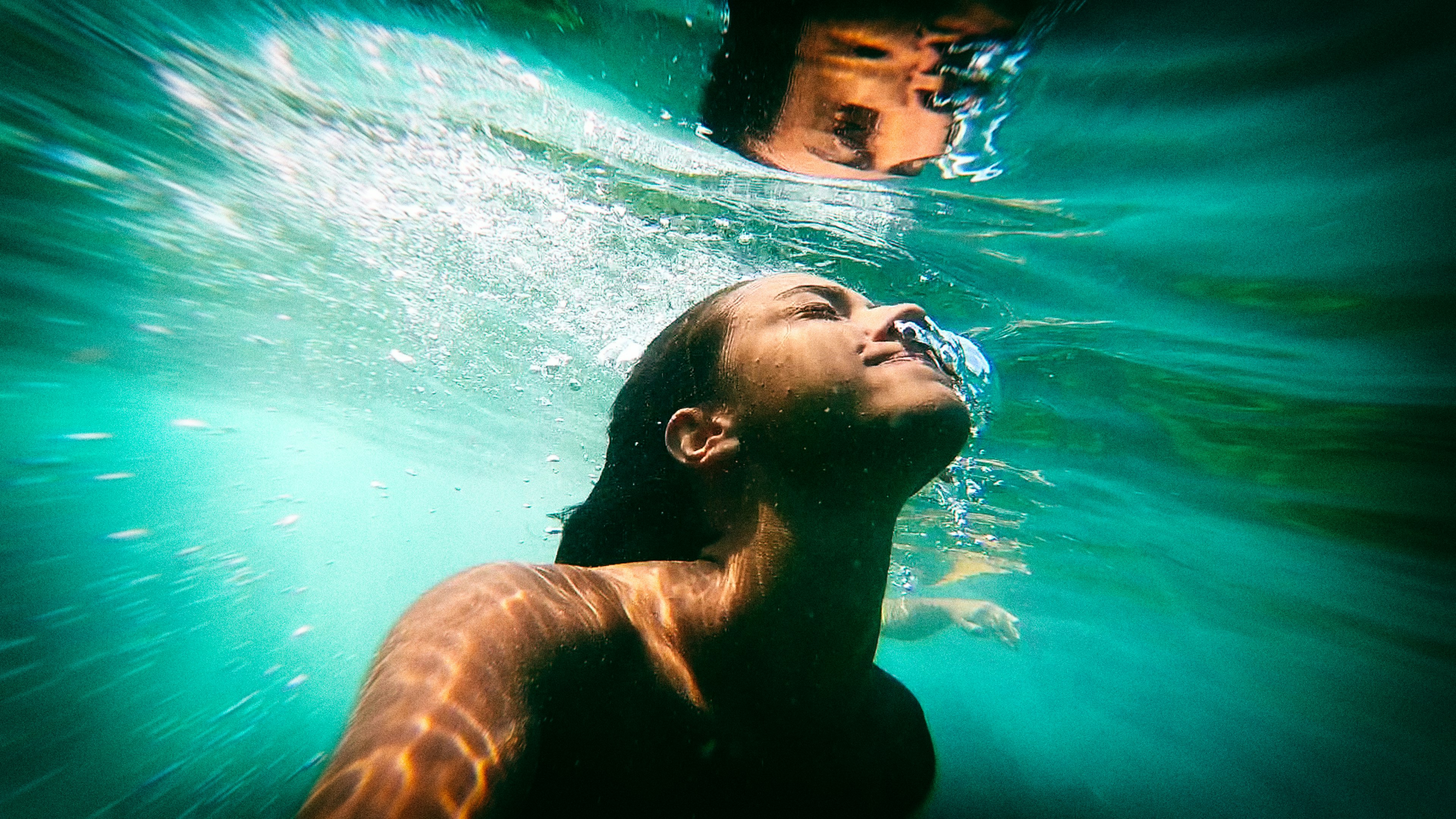 man in water with water splash